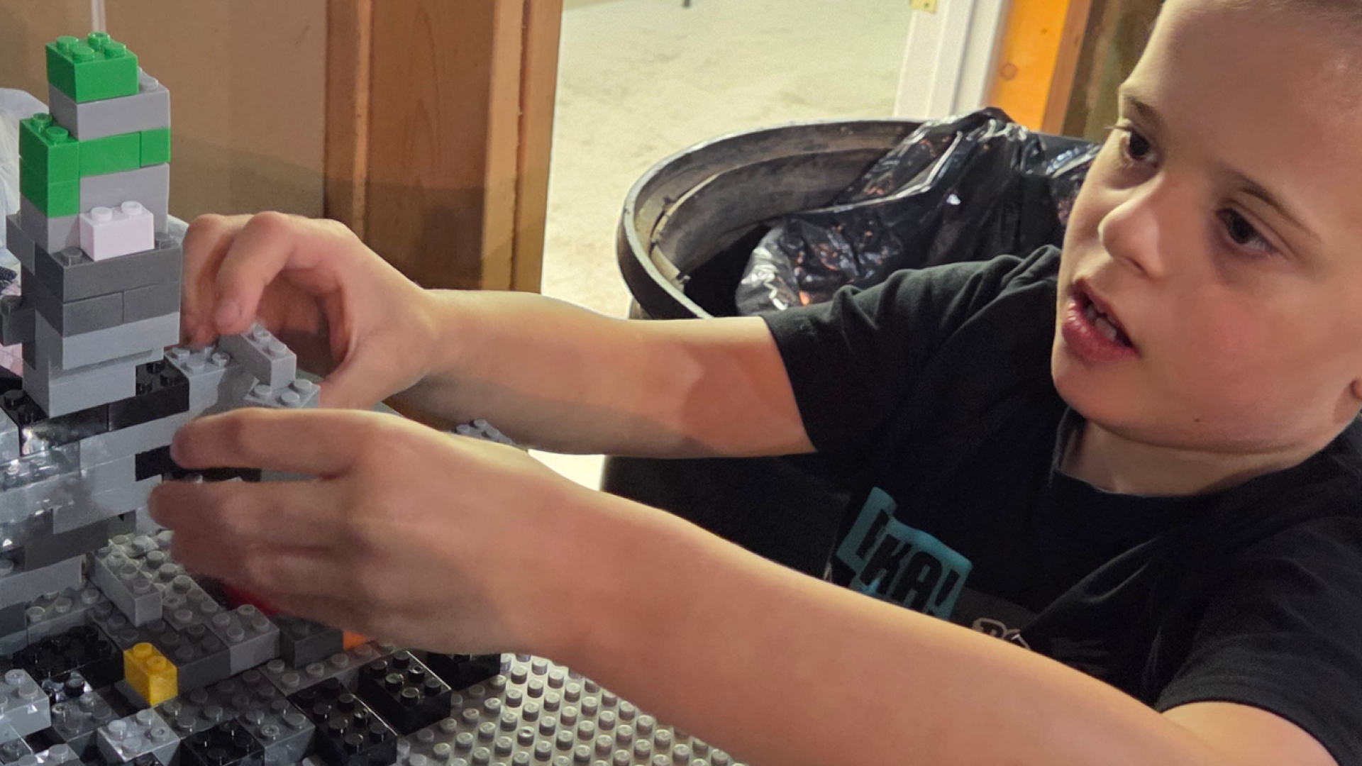 A child building with Lego.